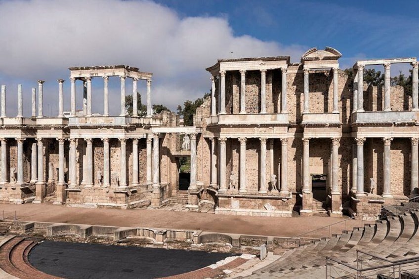 Ancient ruins with columns and a central open space. 4