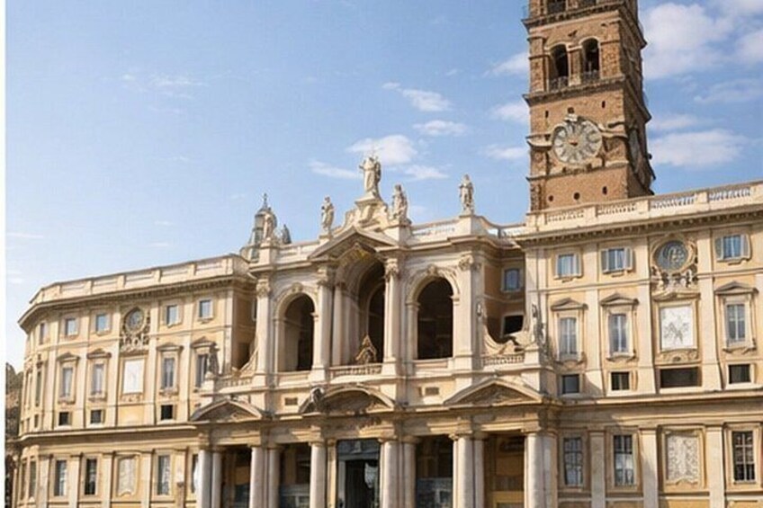 A historic building with classical architecture, including columns, arches, and statues. 3