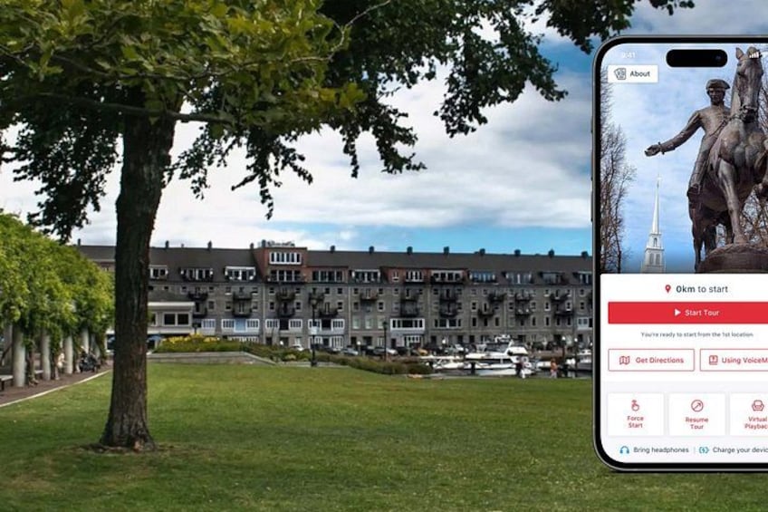 A smartphone displaying a map with a statue and a building in the background. 1