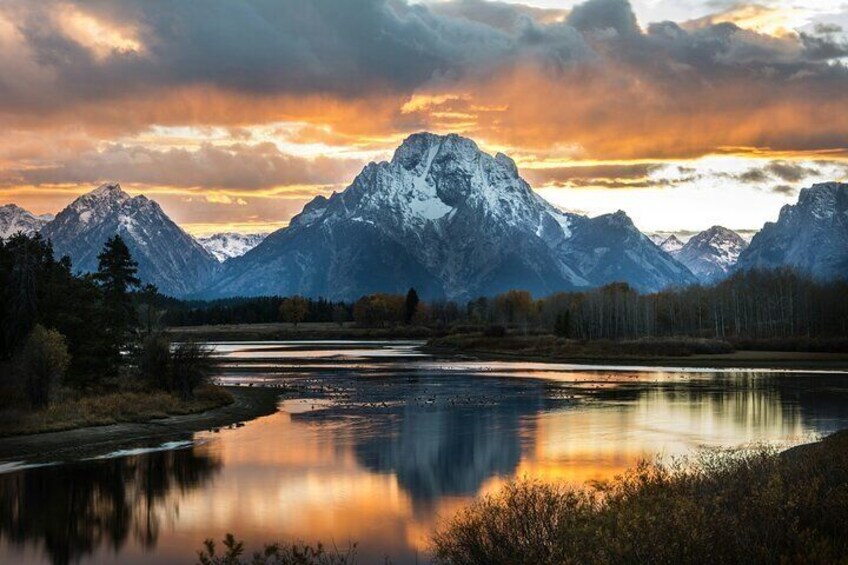 A mountain range with a lake reflecting the peaks. 5