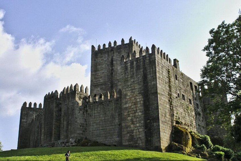 A large stone castle with multiple towers and battlements. 3