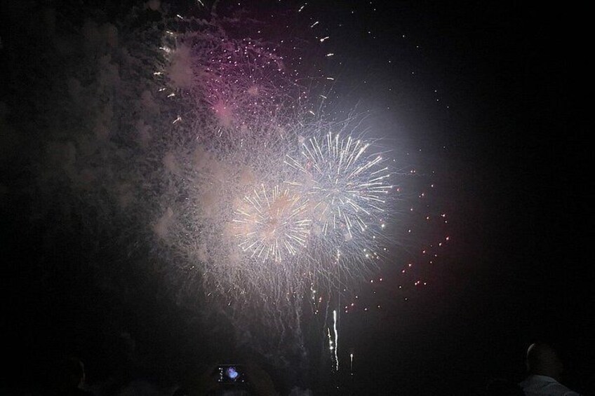 Fireworks exploding in the night sky. 4