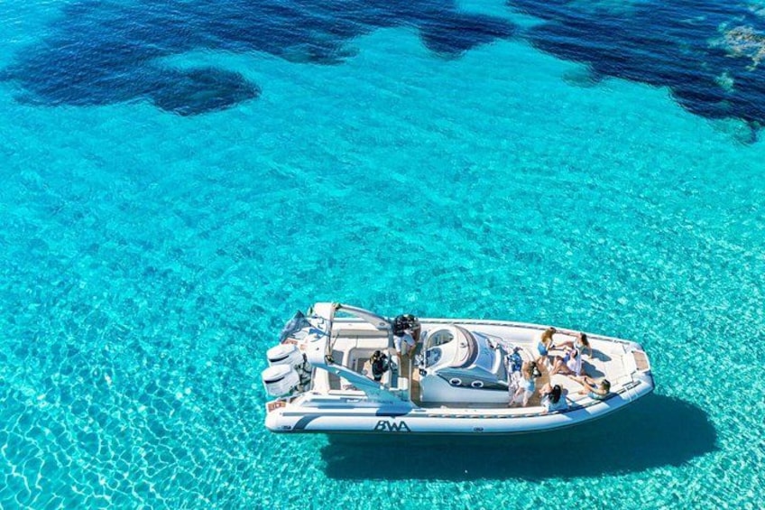 A boat on clear turquoise water. 5