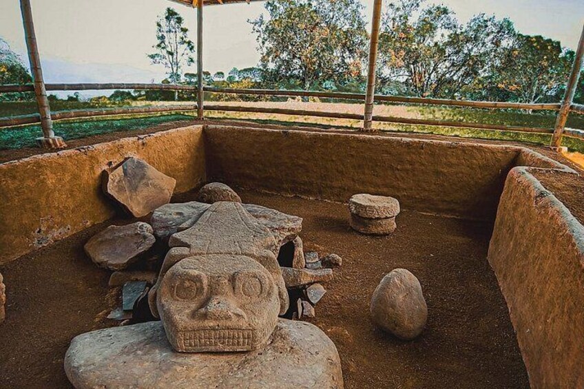 An archaeological site with stone sculptures and artifacts. 2
