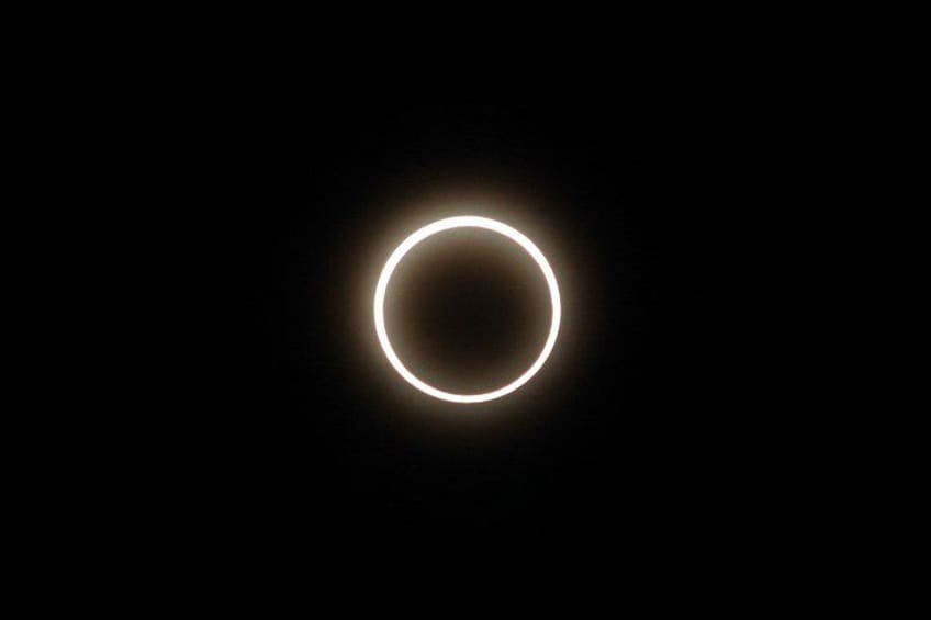 A solar eclipse with a ring of light around the moon. 1