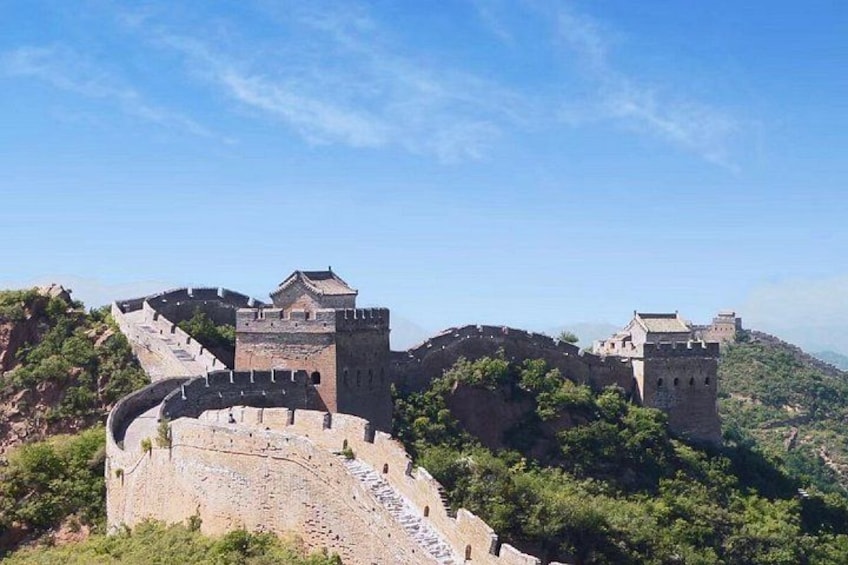 The Great Wall of China, featuring ancient watchtowers and a winding path. 2