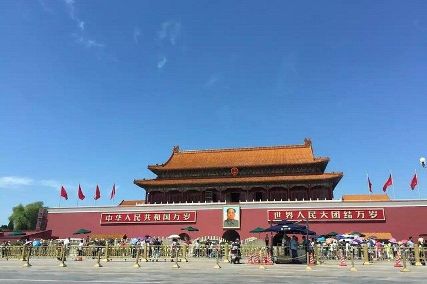 A traditional Chinese building with a red roof and multiple red flags. 2
