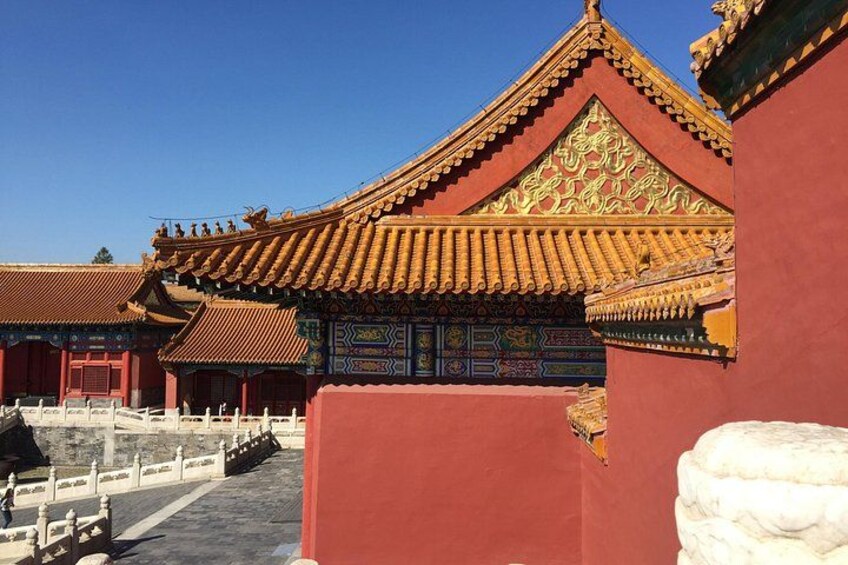 Traditional Chinese architecture with red walls and golden roofs. 3