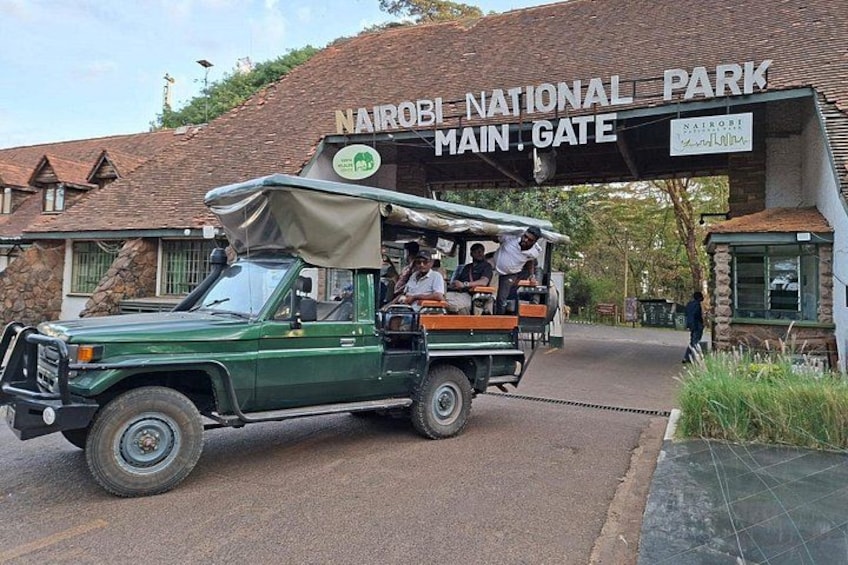 A safari vehicle at Nairobi National Park's main gate. 1