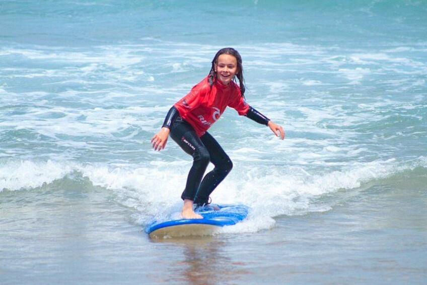 A person surfing on a wave in the ocean. 4