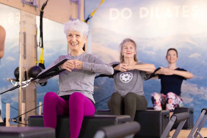 People exercising with resistance bands in a gym. 2