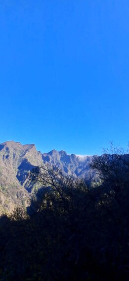 A mountain range with clear blue skies. 5