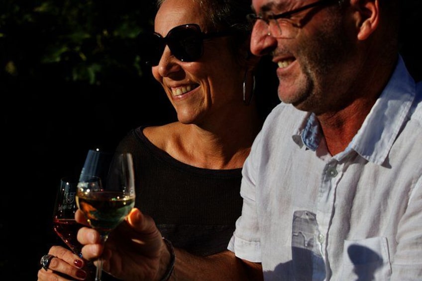 A person holding a glass of wine. 5