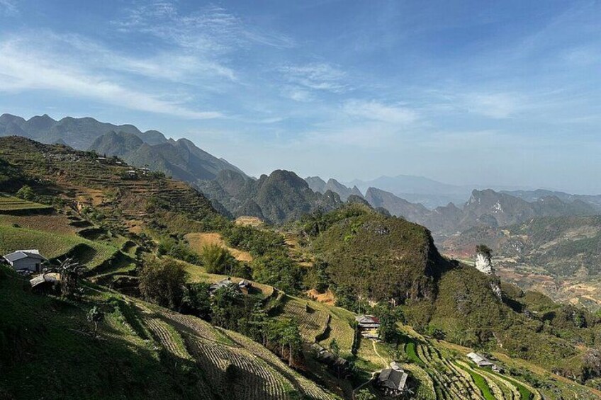 Terraced fields, a mountain range, and a clear sky. 2