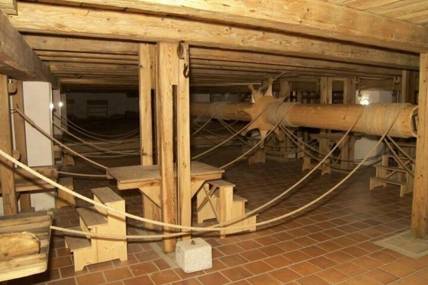 An underground wooden structure with beams and pipes. 4