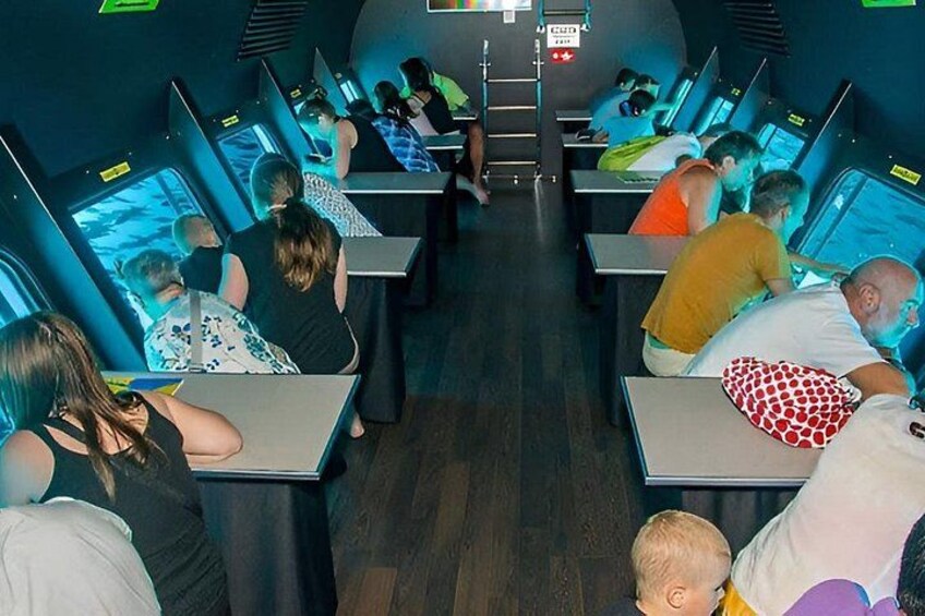 A room with people using computers. 4