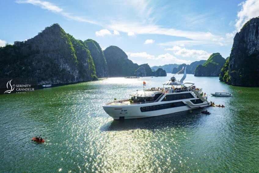 A large yacht on calm waters with a mountainous backdrop. 2