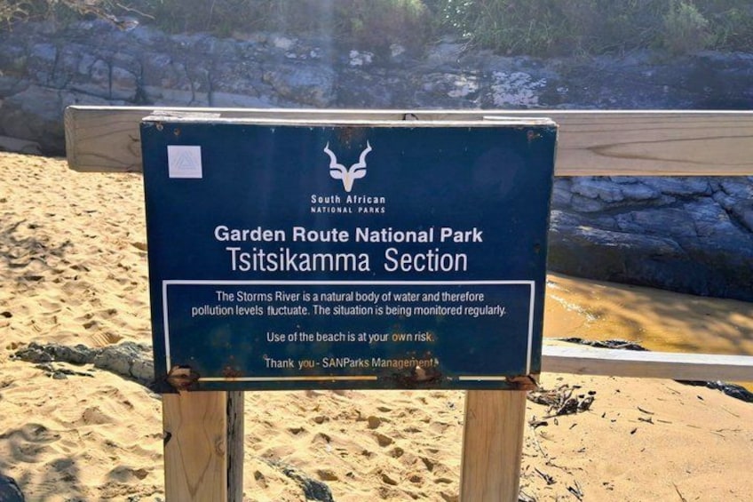A sign at Garden Route National Park's Tsitsikamma Section warning about pollution levels in the Storms River. 2