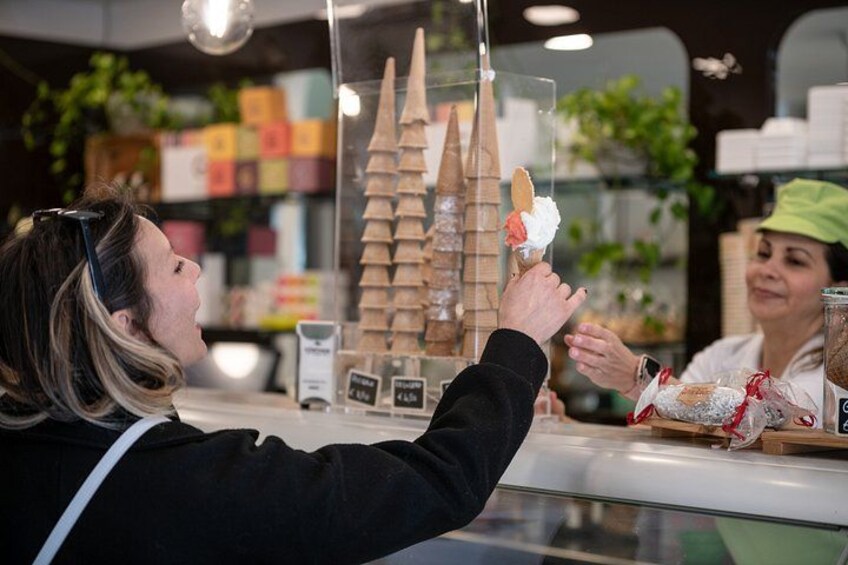 A person ordering food at a counter. 4