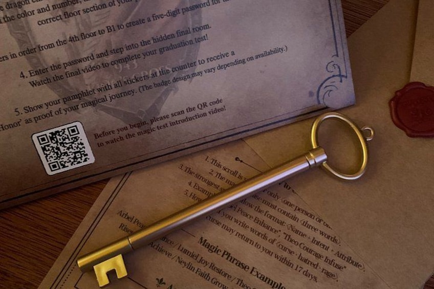 A golden key, a QR code, and a red wax seal on a piece of paper. 4