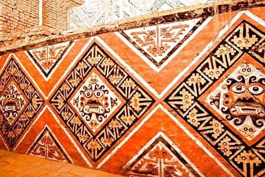 A wall with intricate geometric patterns and traditional motifs. 2