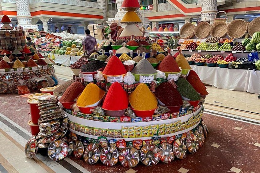 A market stall with colorful spices and grains. 1