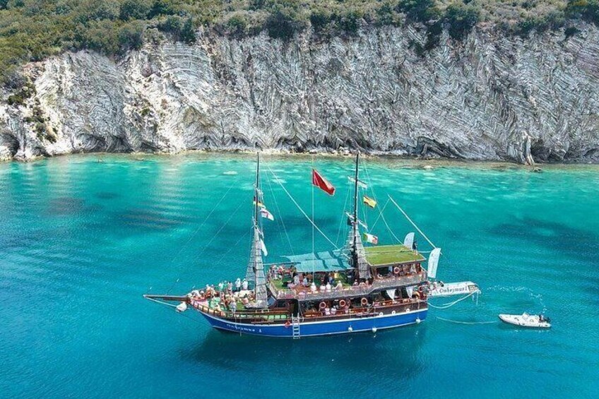 “Anchored near the stunning cliffs and turquoise waters of Krorëza Bay.” 4