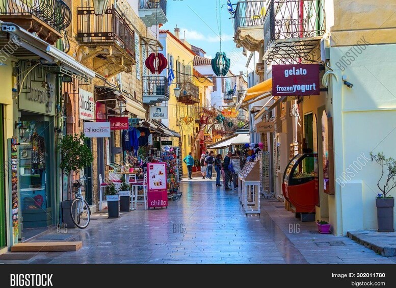 A bustling street with shops, a gelato sign, and a 'chillbox' sign. 4