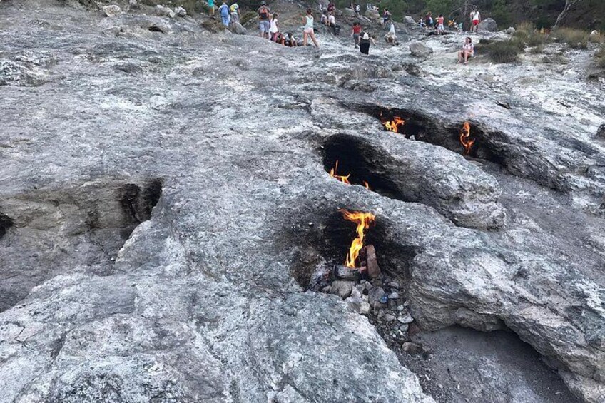 A rocky terrain with several fire pits. 2