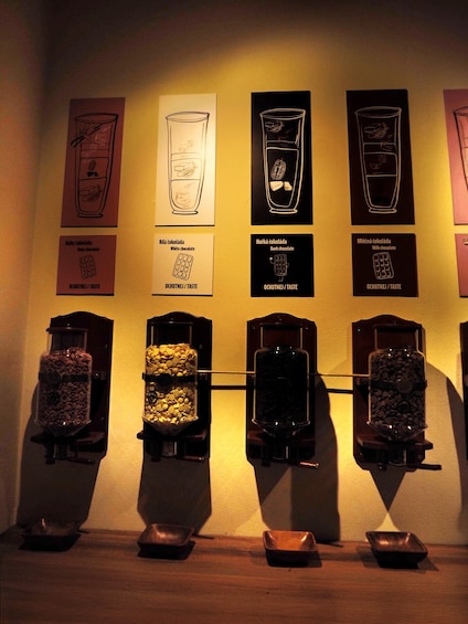 A wall with chocolate tasting samples and labels. 2