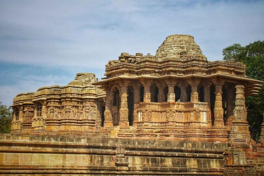 A large, intricately carved temple with multiple spires and detailed stonework. 2