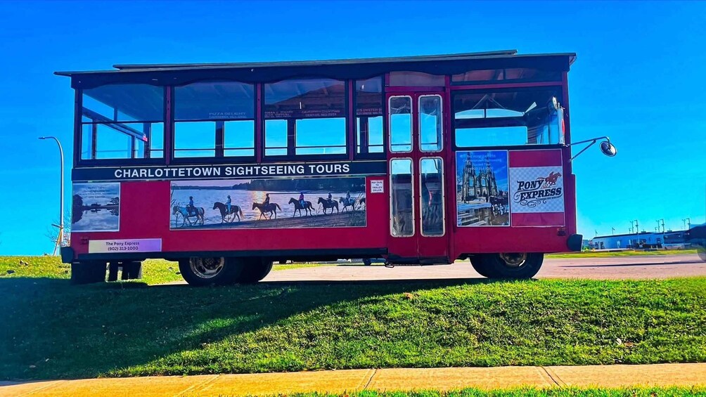 A red trolley with 'Charlottetown Sightseeing Tours' and 'Pony Express' advertisements. 5