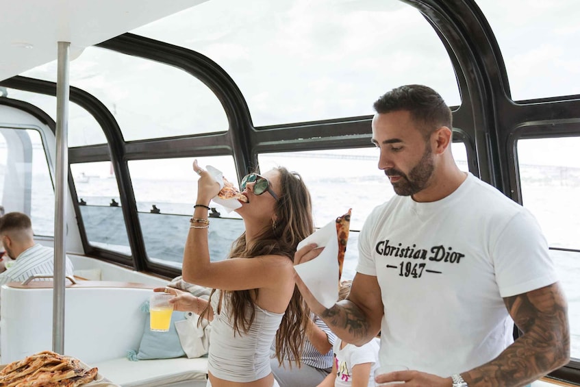 A boat interior with people dining and a man in a white t-shirt with 'Christian Dior 1947' text. 4