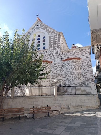A church with intricate geometric patterns and a bell tower. 5