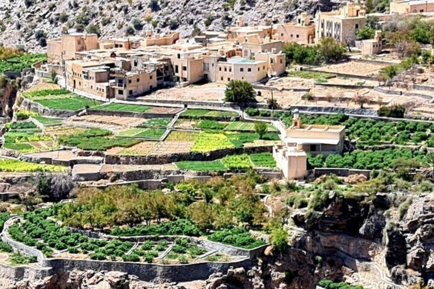 A terraced agricultural landscape with buildings. 4