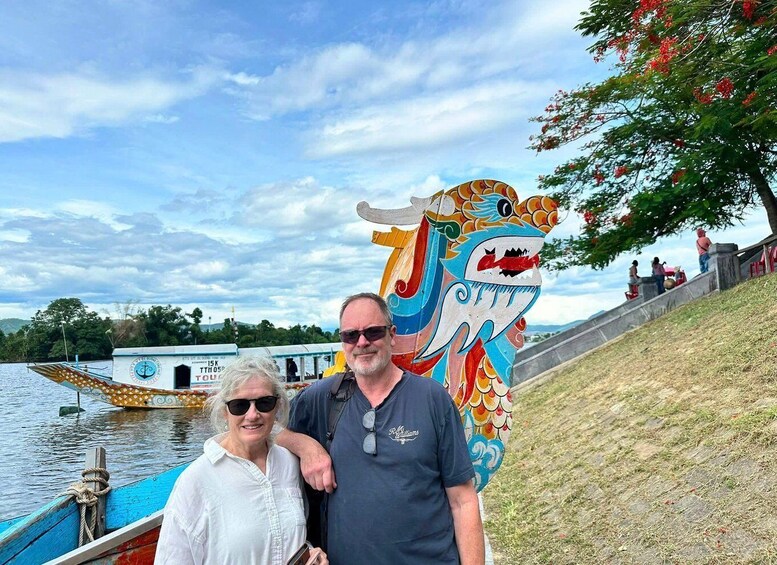 A dragon sculpture, a boat, and a river. 4