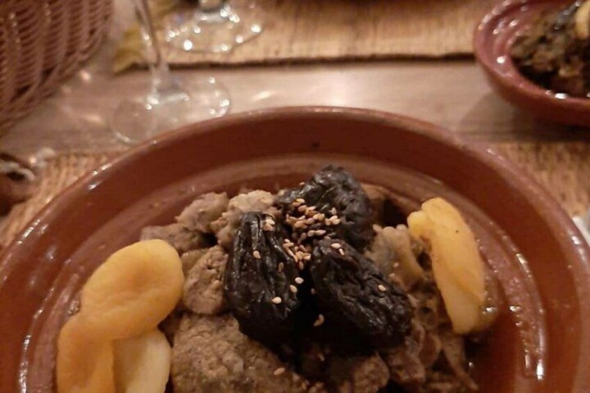 A traditional dish in a clay pot with raisins and nuts. 3