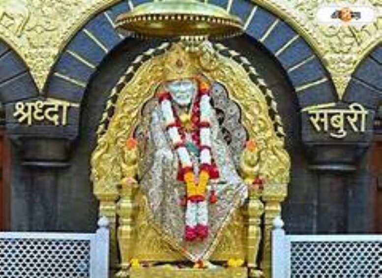 A statue of a deity with a golden halo, surrounded by ornate arches with inscriptions. 2