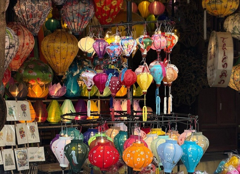 A variety of colorful lanterns hanging in a display. 3