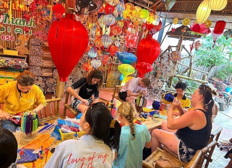 A market stall with colorful lanterns and fans, and people interacting. 4