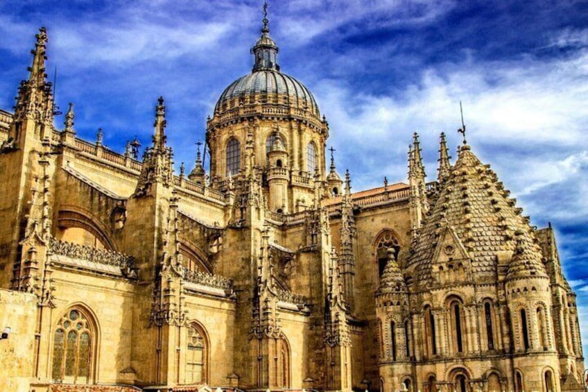 A historic cathedral with intricate architecture, a large dome, and ornate spires. 4
