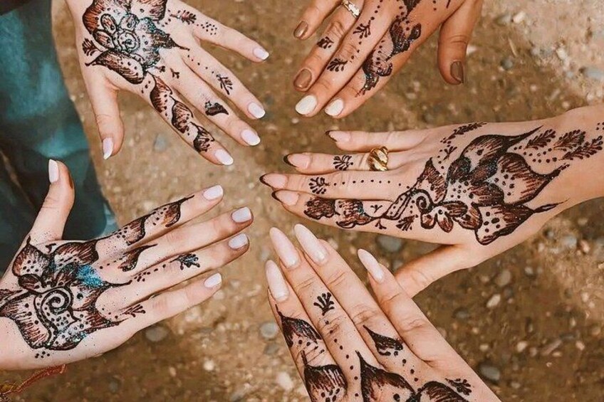 Hands with intricate henna designs. 2