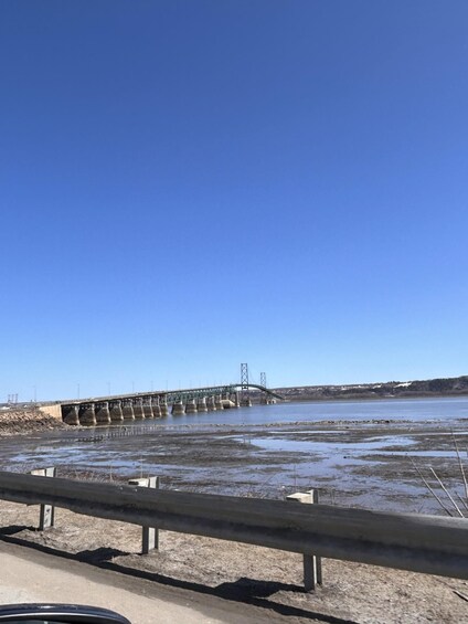 A bridge over a body of water with a clear sky. 4