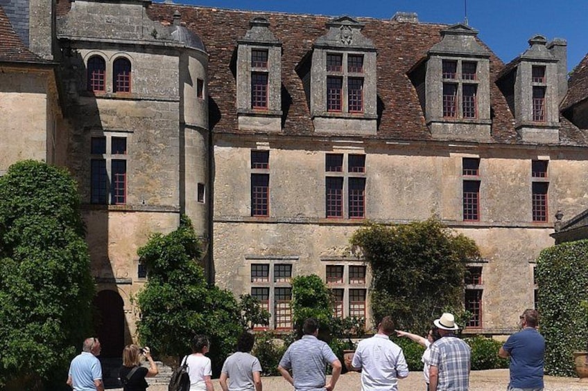A historic building with arched windows and a stone facade. 3
