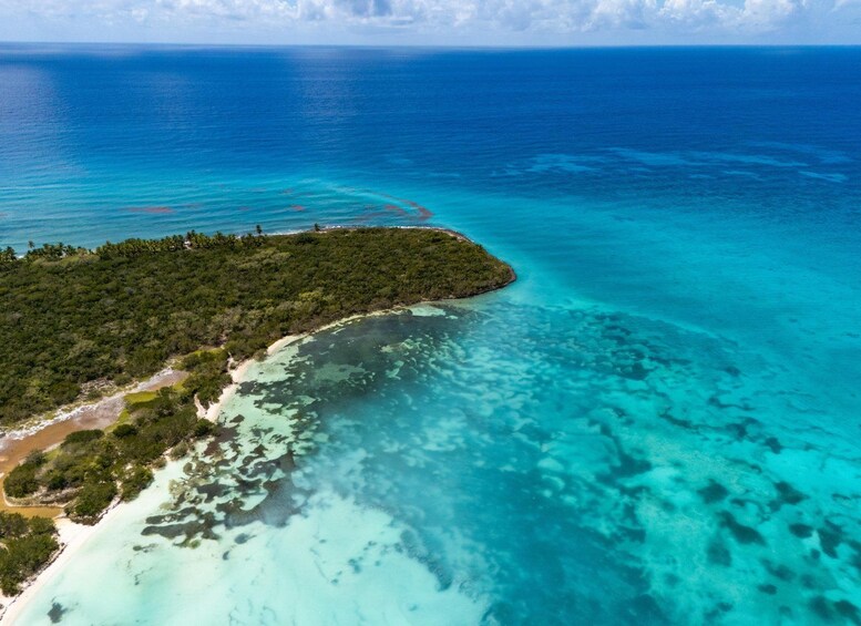 A tropical island surrounded by turquoise waters. 3