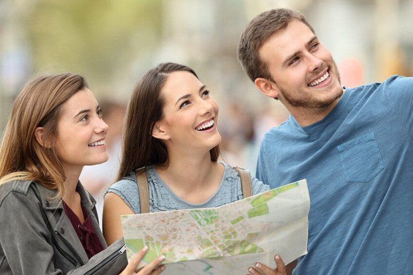Three people holding a map. 2