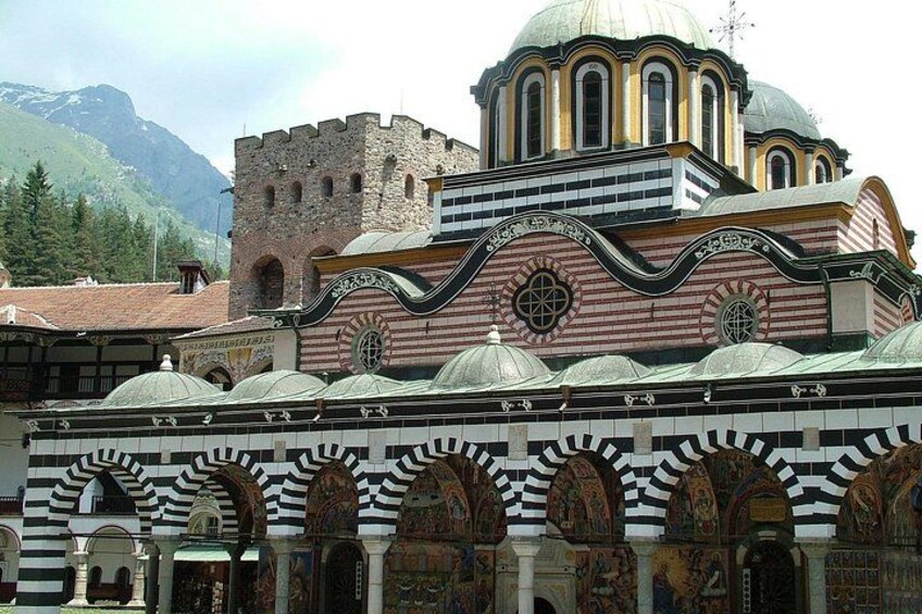 A historic building with a prominent dome and arches. 2