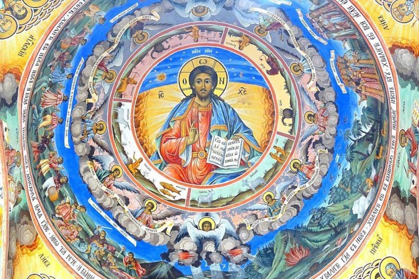 A detailed religious mural with a central figure, surrounded by various scenes and symbols. 2