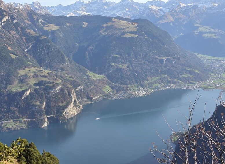 A mountainous landscape with a lake and a small town. 3