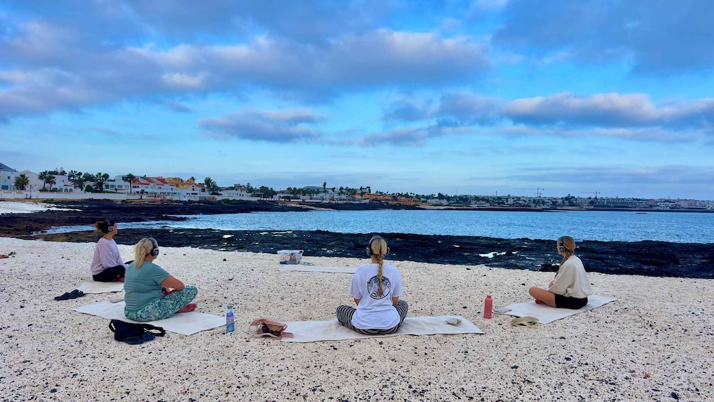 Picture 1 for Activity Corralejo: Sunrise Silent Yoga Experience at Popcorn Beach 3